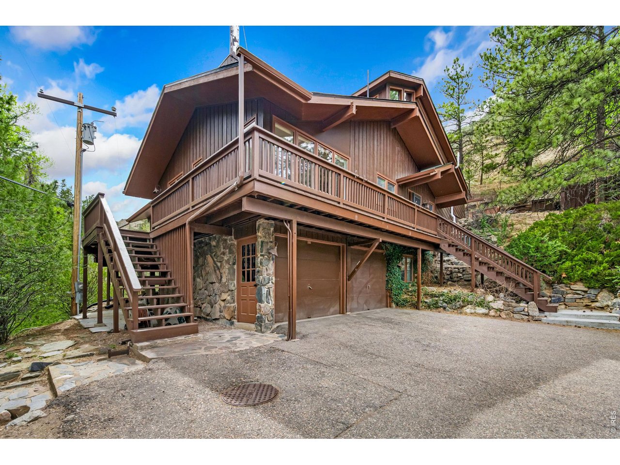 31 Kings Canyon Road Bellvue, CO 80512 - Photo 2 of 50 a view of a house with a wooden fence