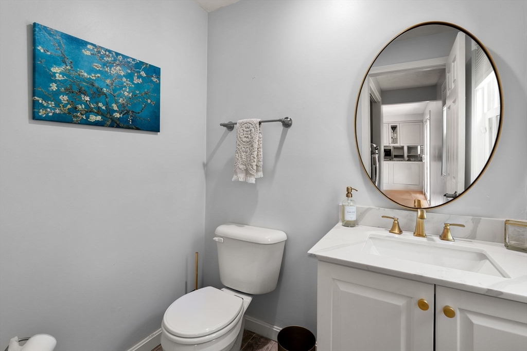 11 Cow Hill Road Sharon, MA 02067 - Photo 13 of 30 a bathroom with a toilet a sink and mirror