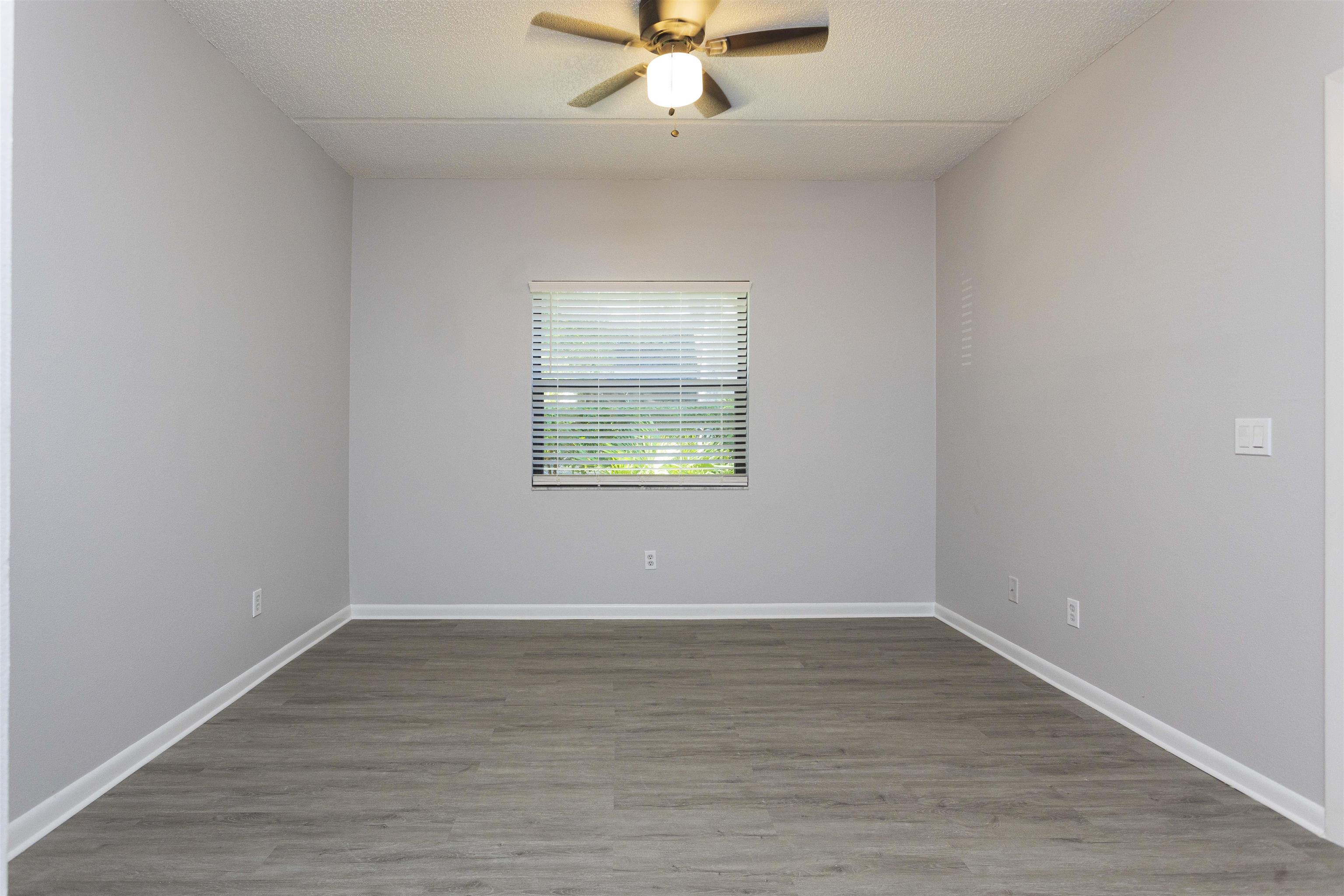 9 Aledo Court St. Augustine, FL 32086 - Photo 12 of 33 wooden floor in an empty room with a window
