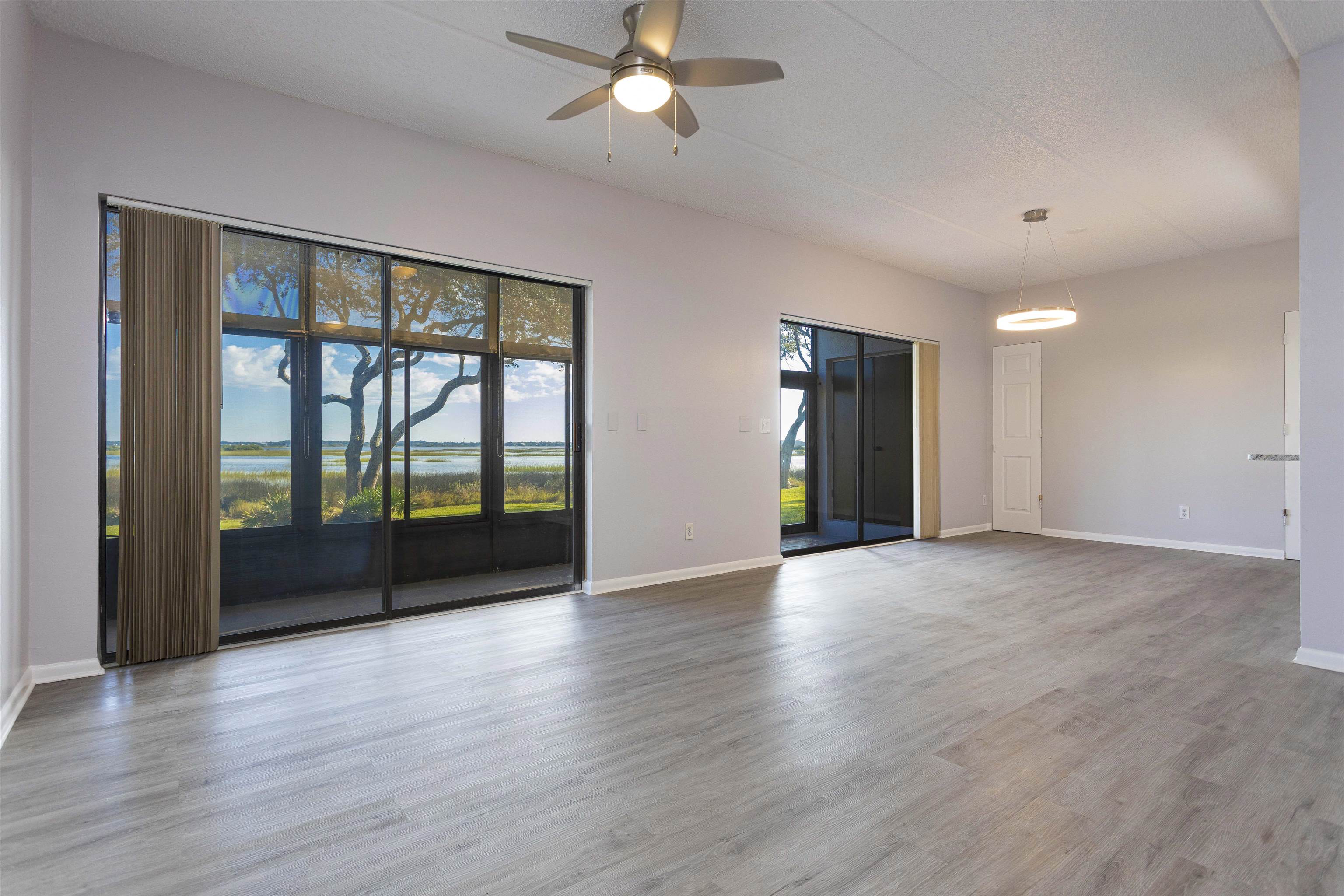 9 Aledo Court St. Augustine, FL 32086 - Photo 16 of 33 a view of an empty room with wooden floor and a window