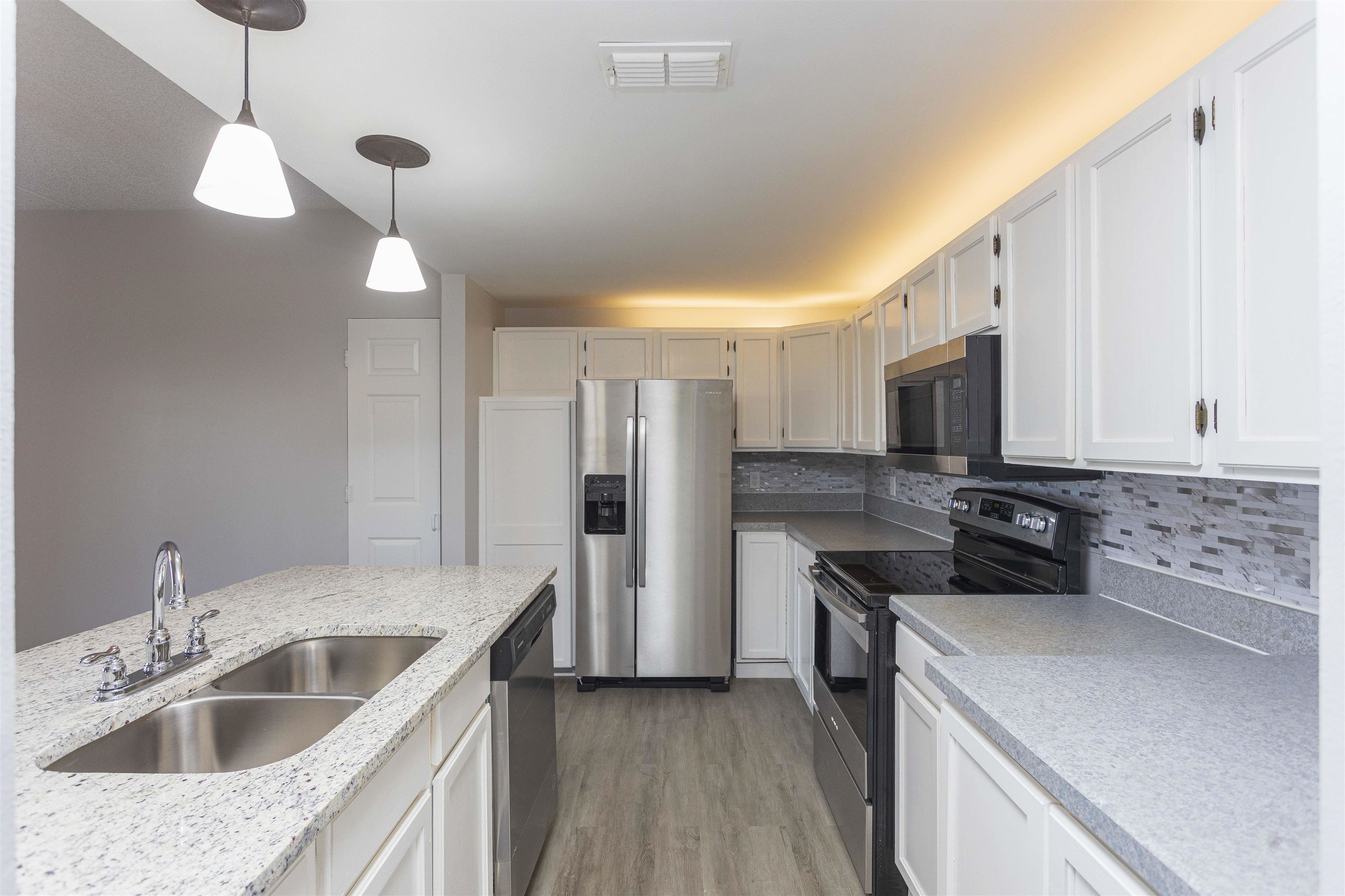 9 Aledo Court St. Augustine, FL 32086 - Photo 2 of 33 a kitchen with a sink stove and refrigerator