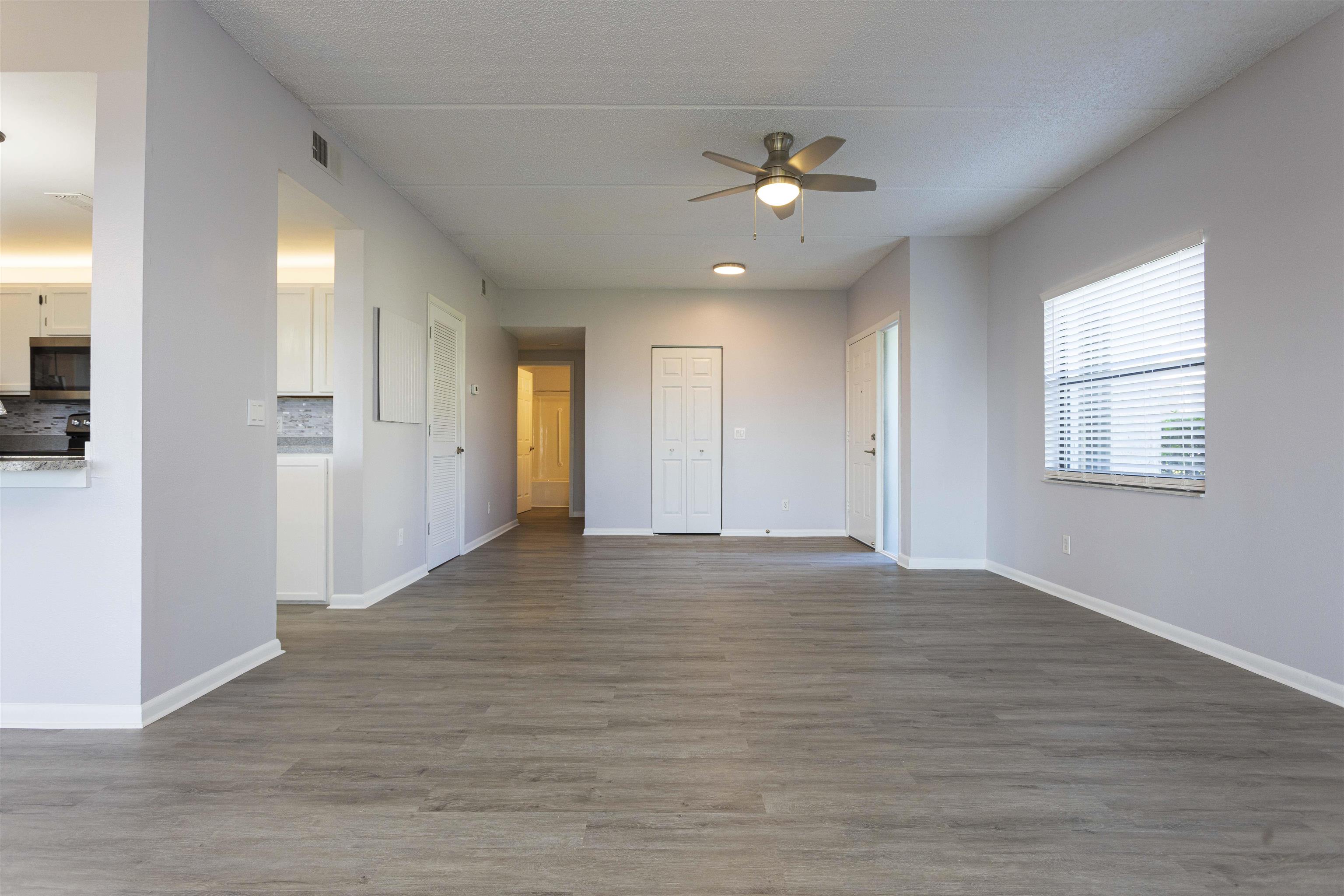 9 Aledo Court St. Augustine, FL 32086 - Photo 25 of 33 a view of an empty room with window and wooden floor