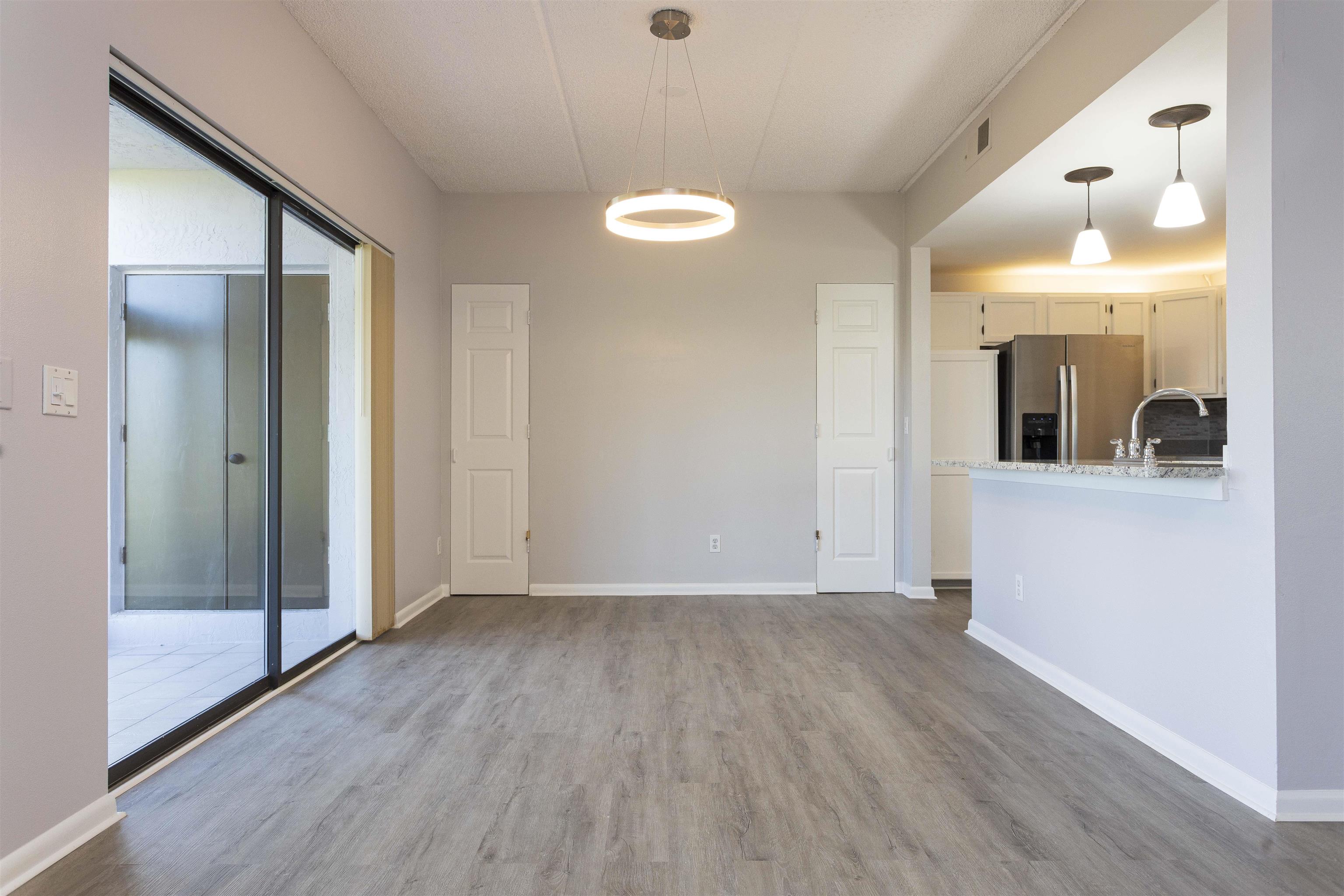 9 Aledo Court St. Augustine, FL 32086 - Photo 28 of 33 a view of a room with wooden floor and mirror