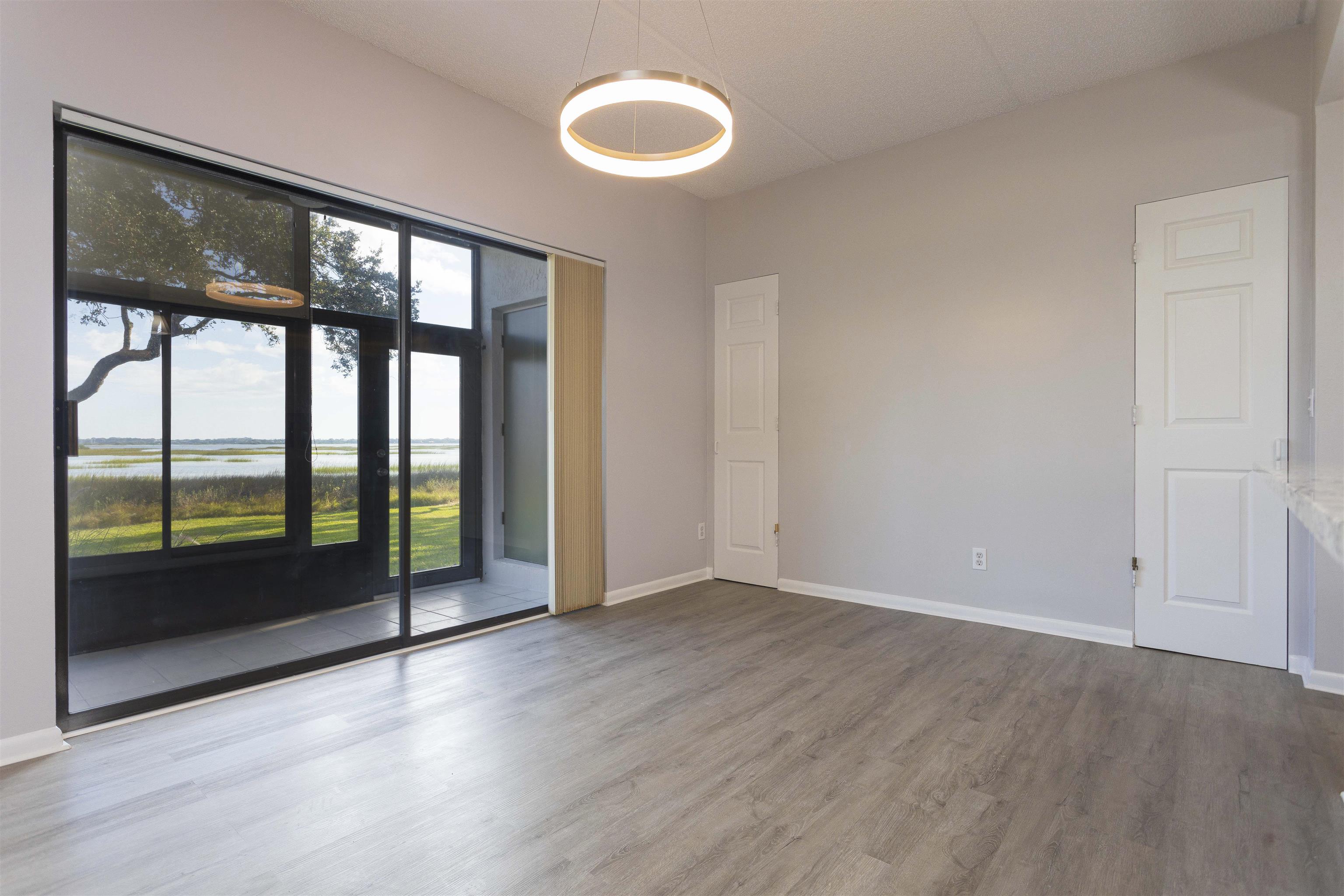 9 Aledo Court St. Augustine, FL 32086 - Photo 33 of 33 wooden floor in an empty room with a window