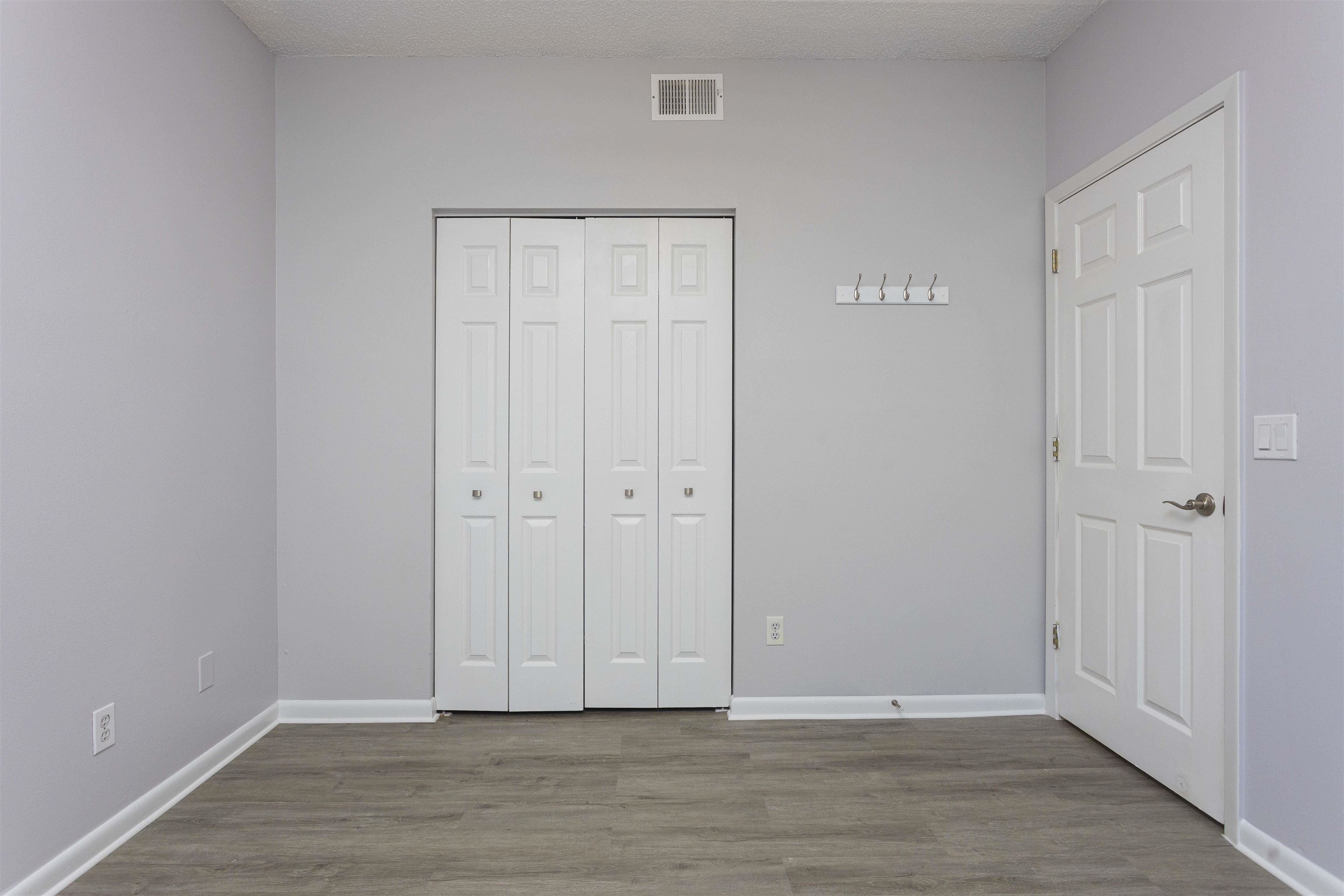 9 Aledo Court St. Augustine, FL 32086 - Photo 6 of 33 a view of an empty room with wooden floor