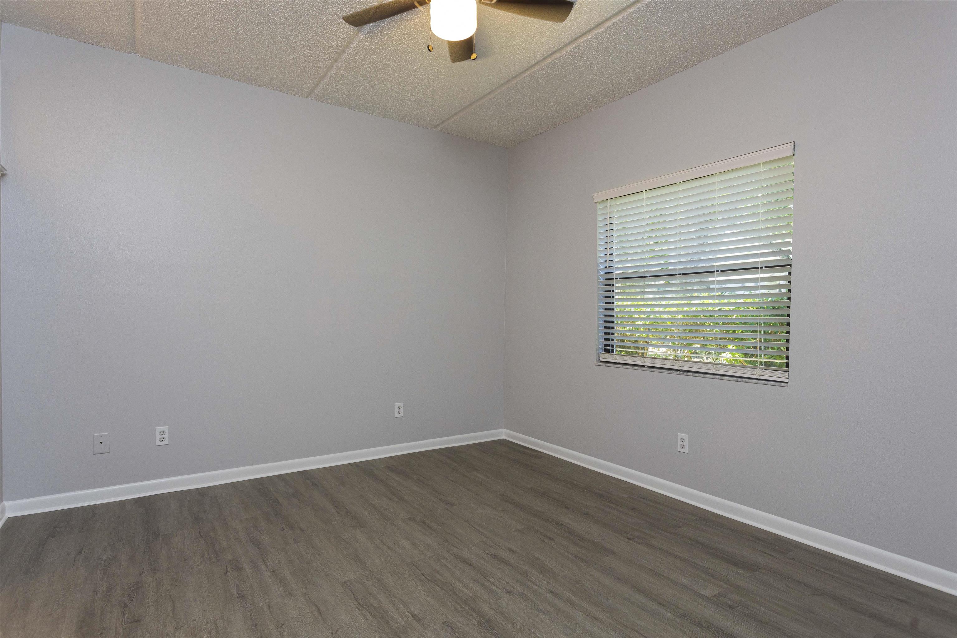 9 Aledo Court St. Augustine, FL 32086 - Photo 8 of 33 wooden floor in an empty room with a window