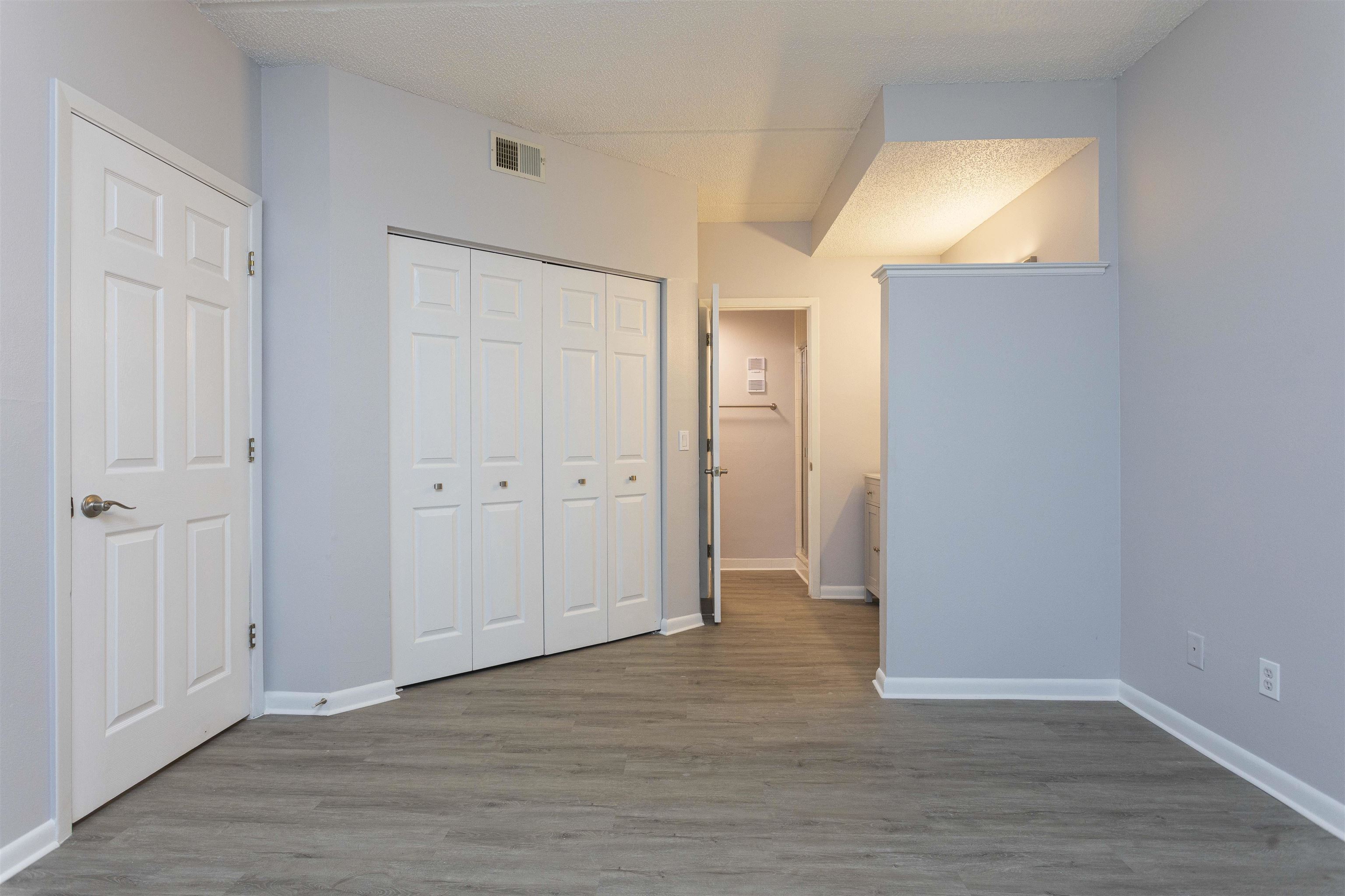 9 Aledo Court St. Augustine, FL 32086 - Photo 9 of 33 an empty room with wooden floor and windows