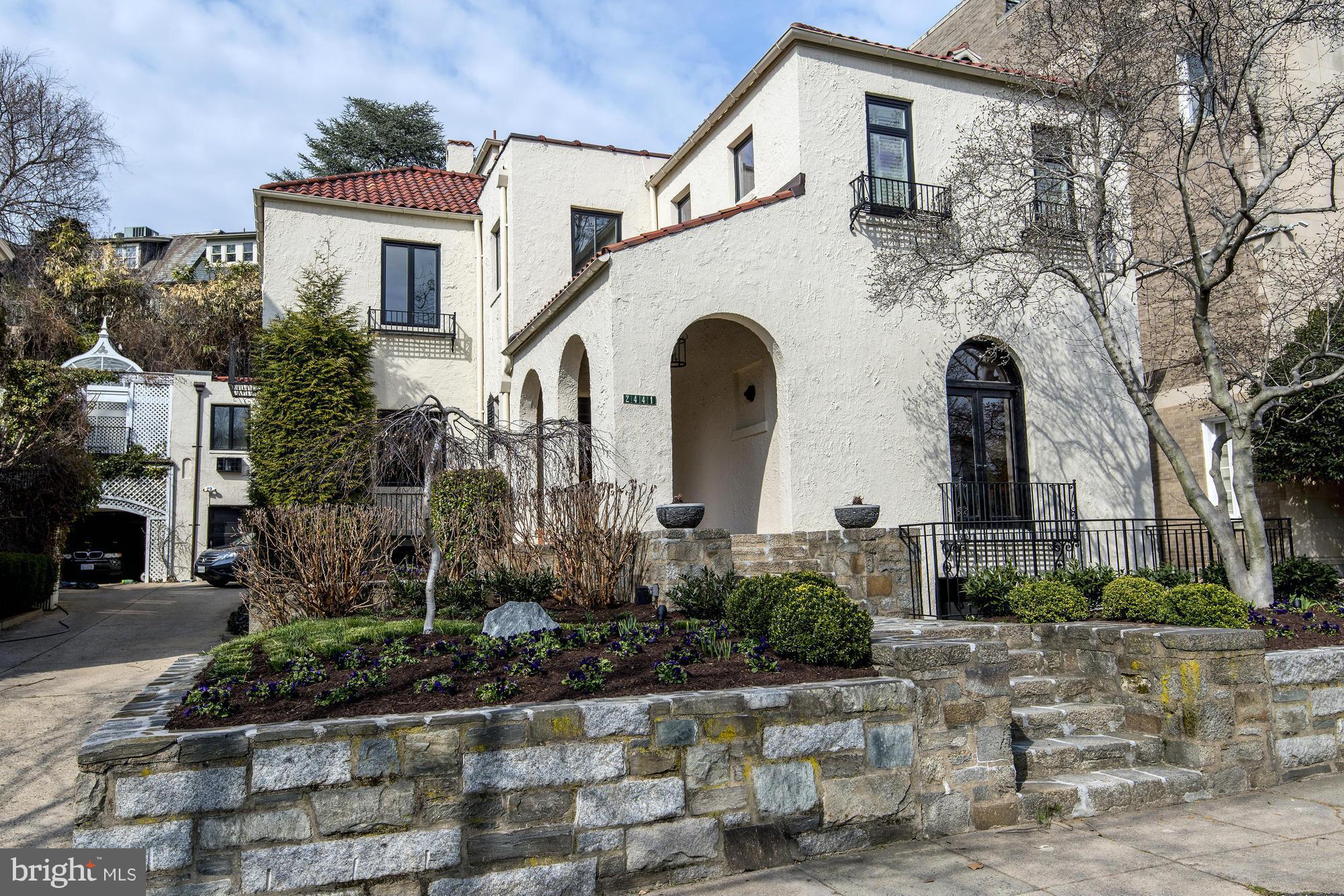 2441 California Street Northwest Washington, DC 20008 - Photo 1 of 22 a front view of a house with garden