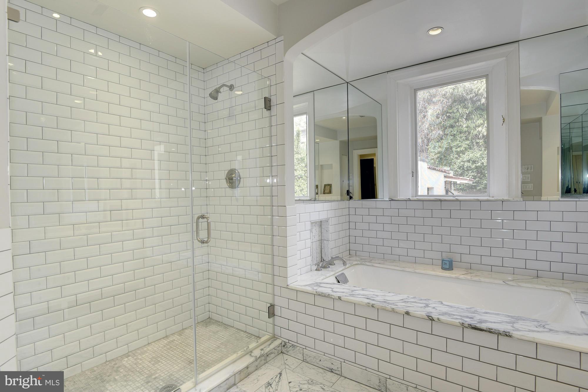 2441 California Street Northwest Washington, DC 20008 - Photo 12 of 22 a bathroom with a bathtub and a shower