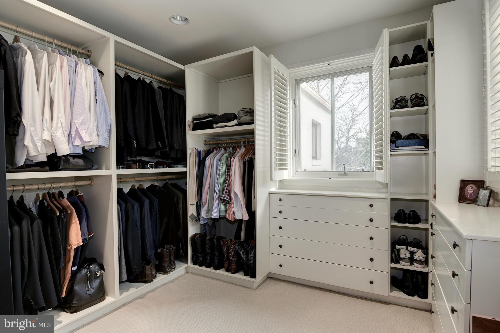 2441 California Street Northwest Washington, DC 20008 - Photo 13 of 22 a view of walk in closet with clothes and shoes
