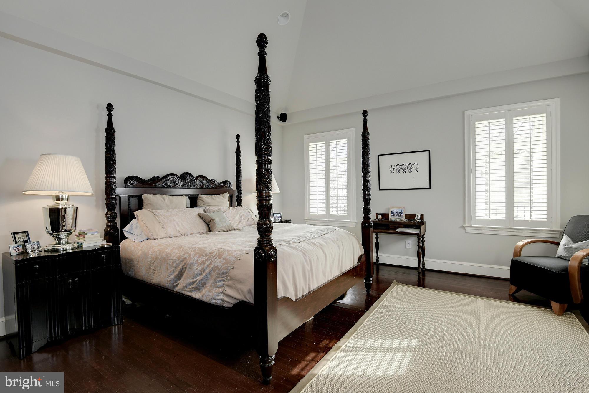 2441 California Street Northwest Washington, DC 20008 - Photo 14 of 22 a bedroom with a bed a lamp and a window