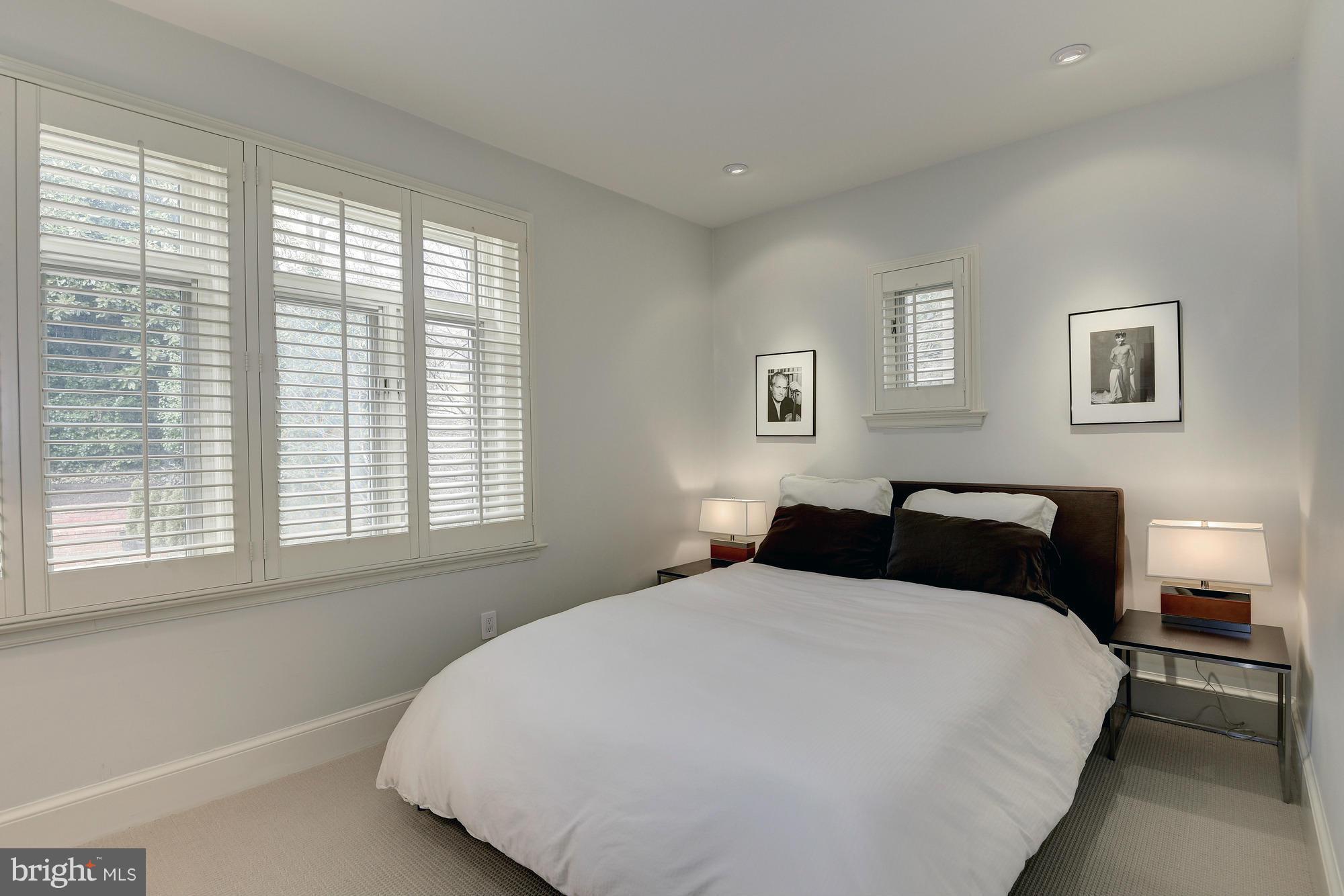 2441 California Street Northwest Washington, DC 20008 - Photo 16 of 22 a bedroom with a bed and next to a window