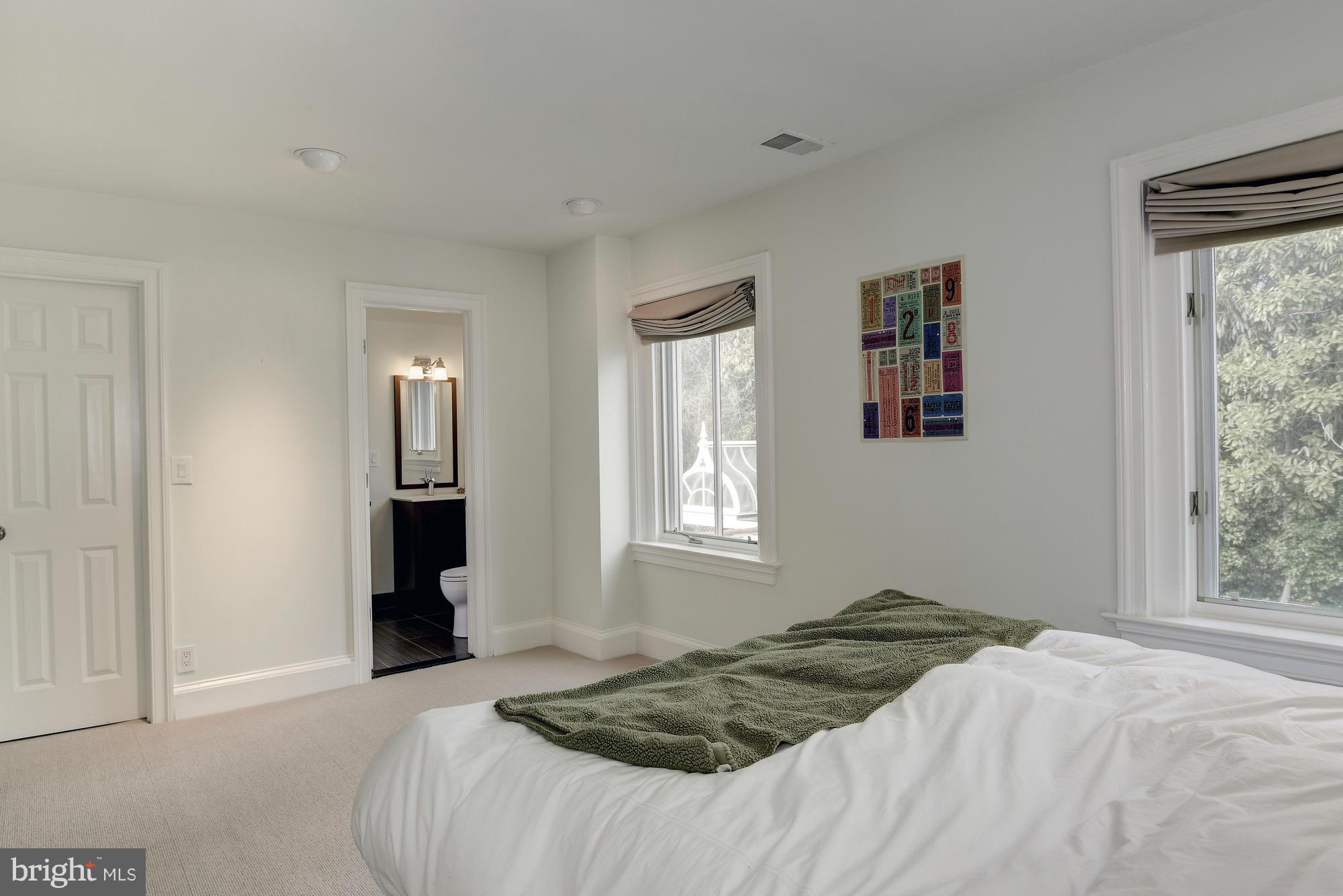 2441 California Street Northwest Washington, DC 20008 - Photo 18 of 22 a bedroom with a bed and a window