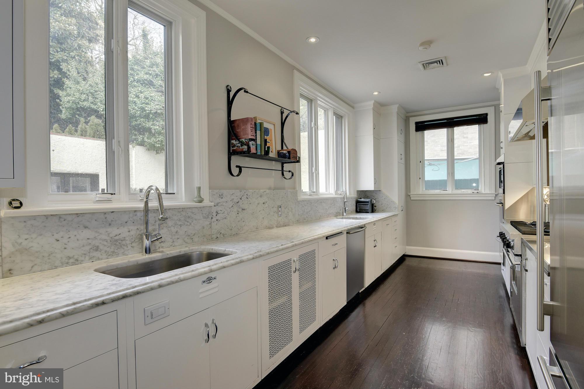 2441 California Street Northwest Washington, DC 20008 - Photo 7 of 22 a kitchen with sink and window