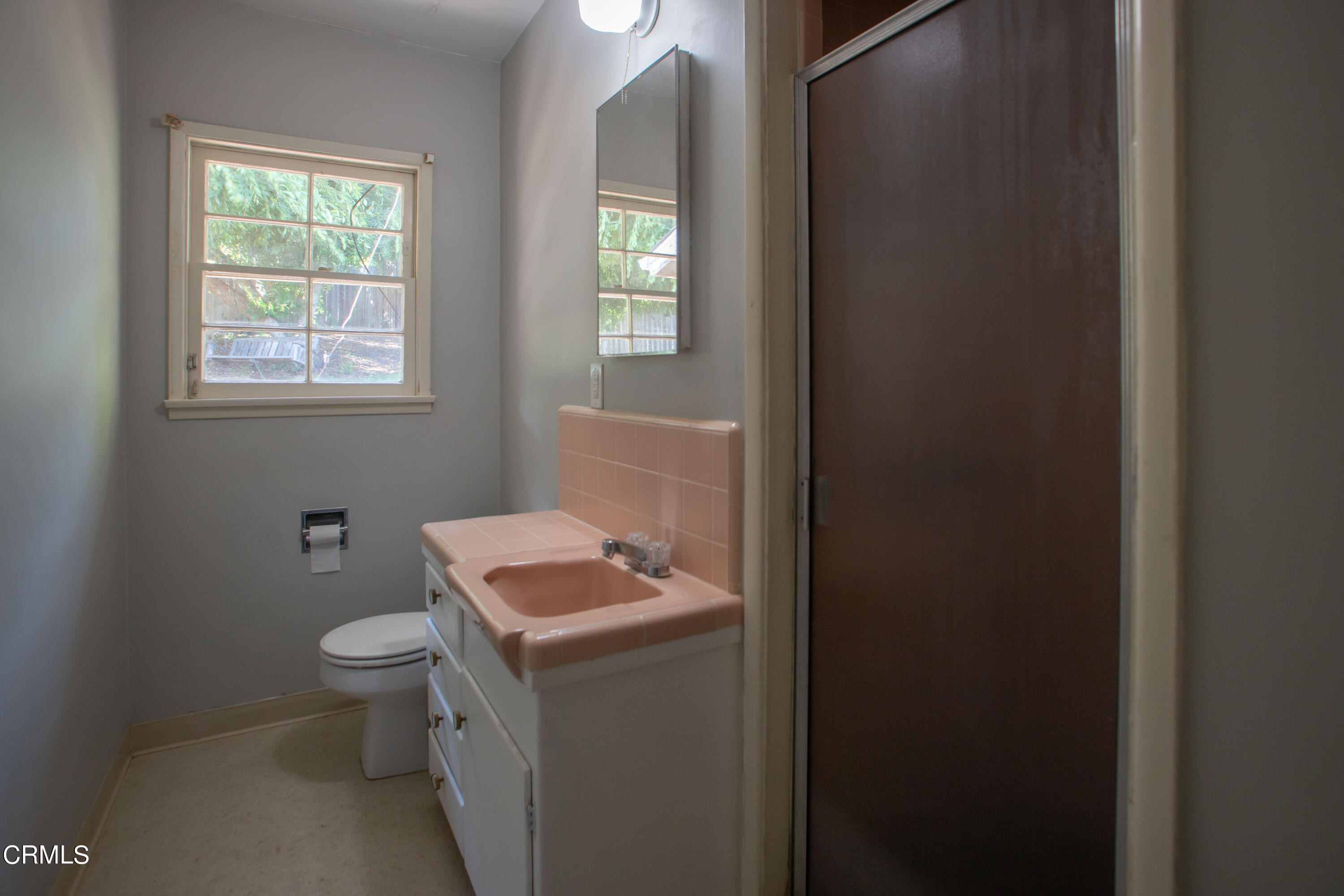 2971 Foothill Road Ventura, CA 93003 - Photo 10 of 25 a bathroom with a toilet sink and mirror
