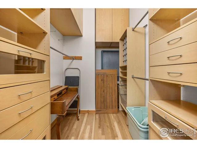 a bathroom with a sink mirror and a shower