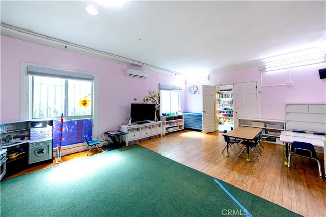 a view of an entryway with wooden floor