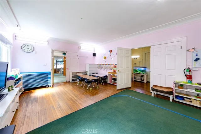 a children room with toys and a book shelf