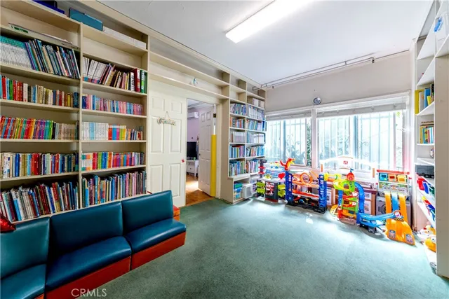 a living room with lots of furniture and white walls
