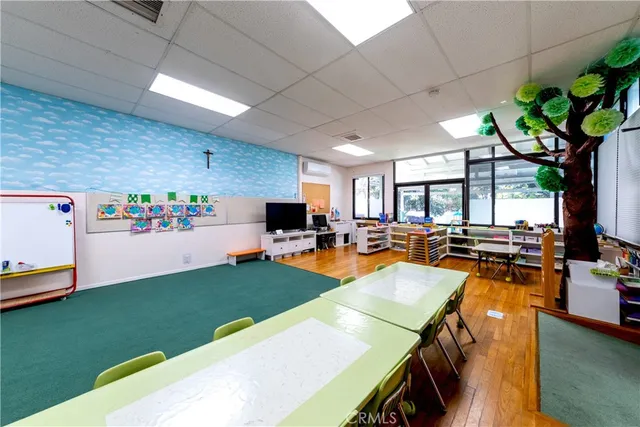 a view of a room with wooden floor and cabinet