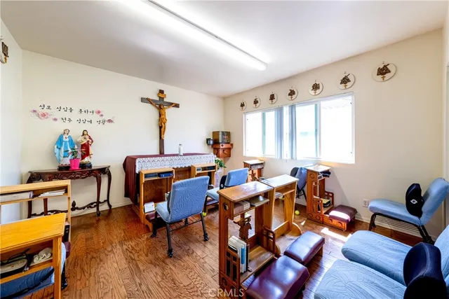 a view of a room with wooden floor