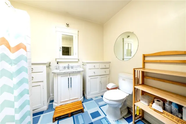 a bathroom with a glass shower door