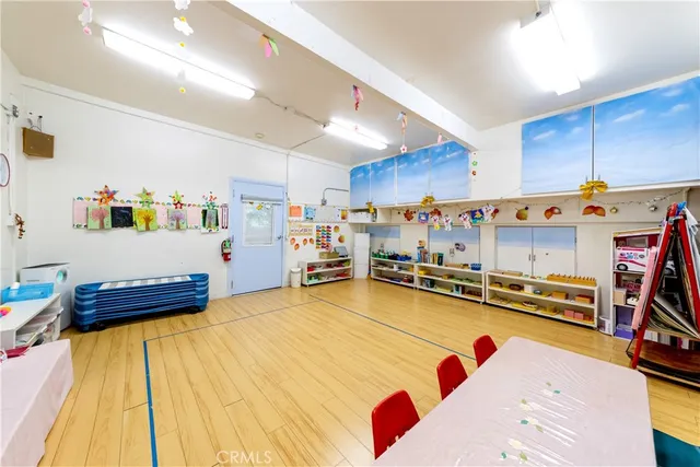 a view of a porch with furniture and a yard