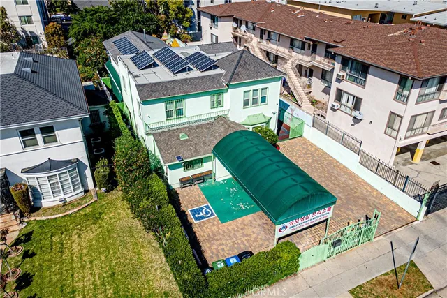 an aerial view of residential houses with outdoor space