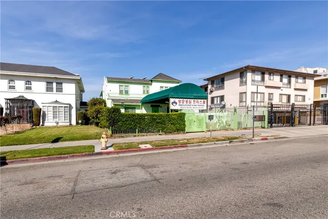 a front view of residential houses with street