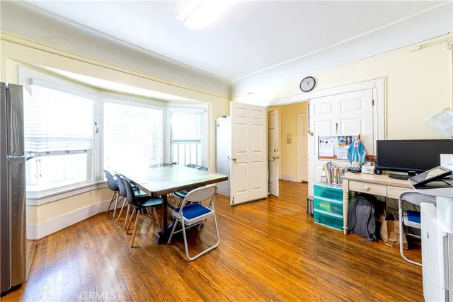 a living room with furniture a pool table and a flat screen tv