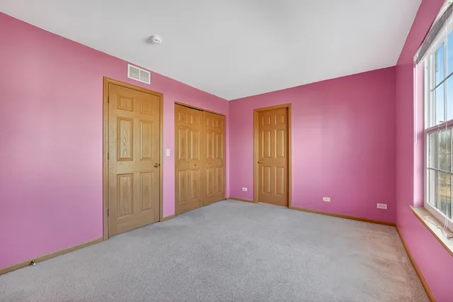 a bathroom with a sink vanity mirror and toilet