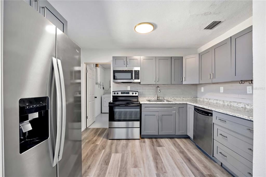 6319 Lafayette Road Bradenton, FL 34207 - Photo 11 of 30 a kitchen with a refrigerator stove and sink
