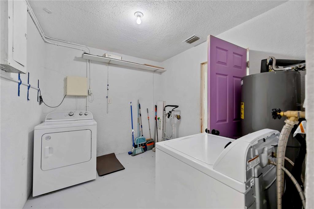 6319 Lafayette Road Bradenton, FL 34207 - Photo 26 of 30 a view of a storage & utility room with dryer and washer