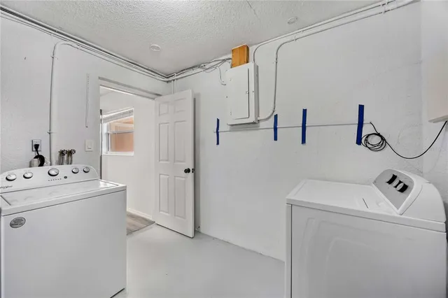 a bathroom with a sink and mirror with toilet