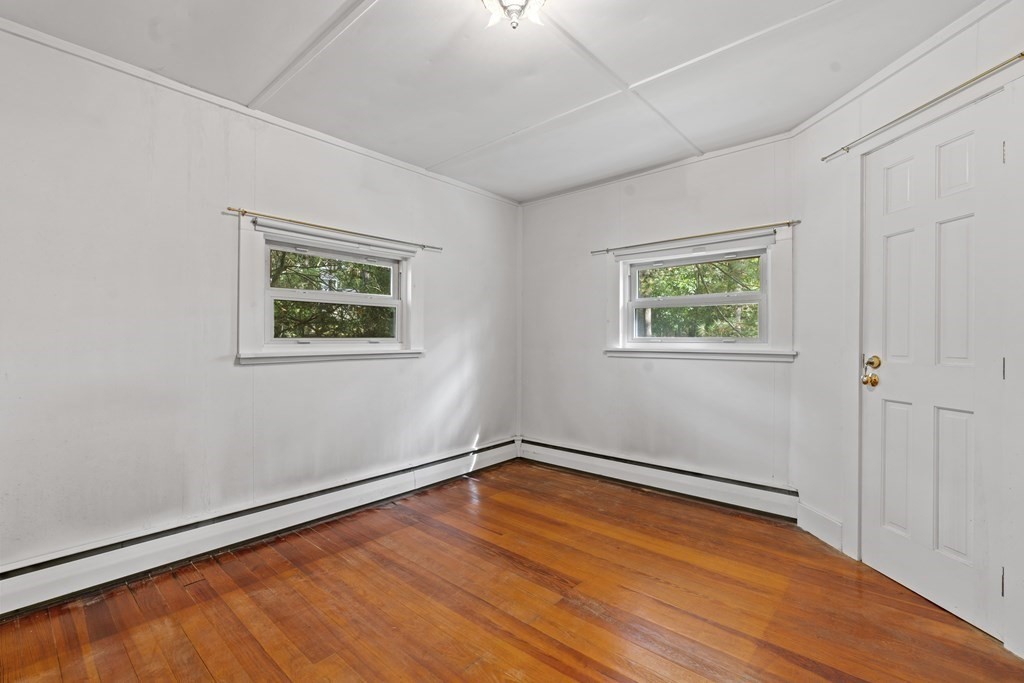 44 None Such Way Weston, MA 02493 - Photo 7 of 11 a view of room with window and wooden floor