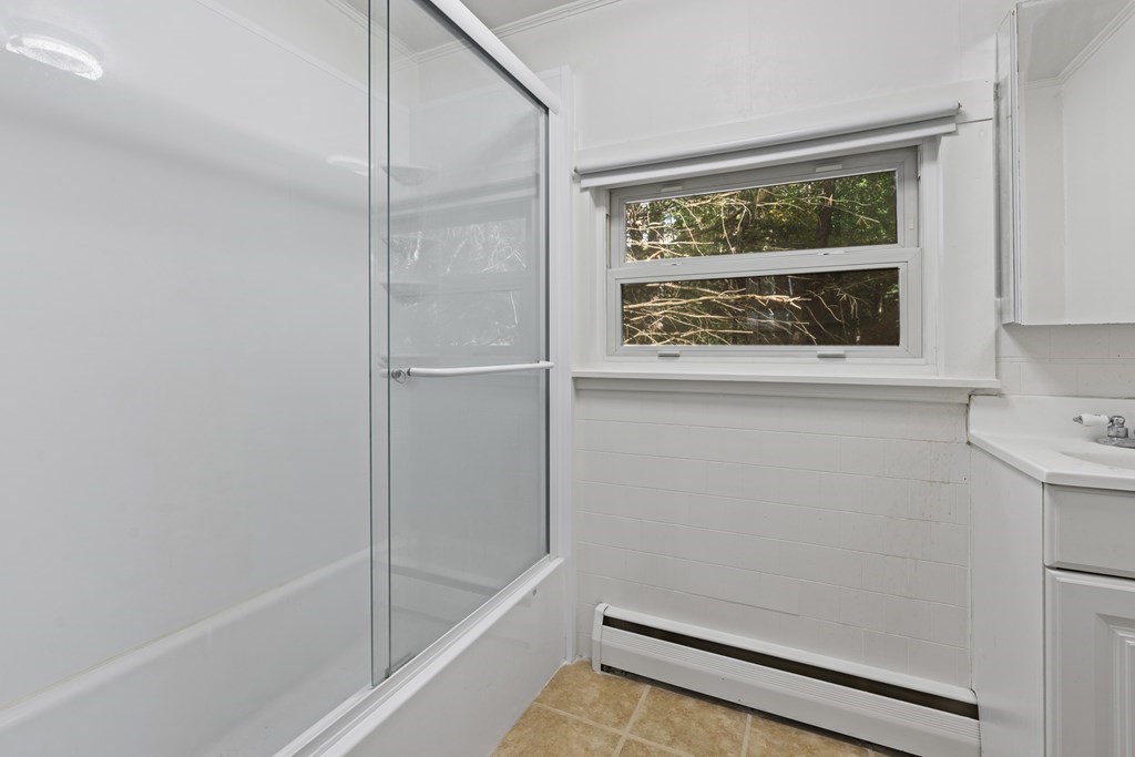 44 None Such Way Weston, MA 02493 - Photo 9 of 11 a bathroom with a bathtub and a shower