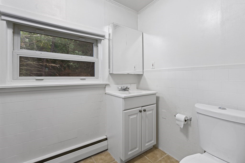 44 None Such Way Weston, MA 02493 - Photo 10 of 11 a bathroom with a sink a toilet and a window
