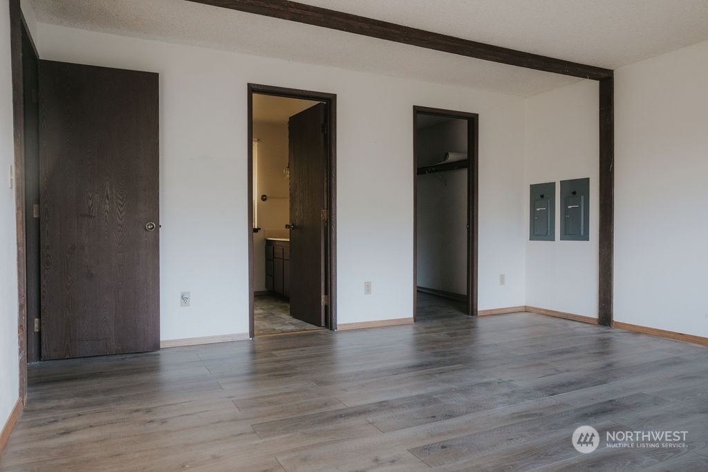 3142 Undie Rd Forks Forks, WA 98331 - Photo 9 of 40 an empty room with wooden floor and closet