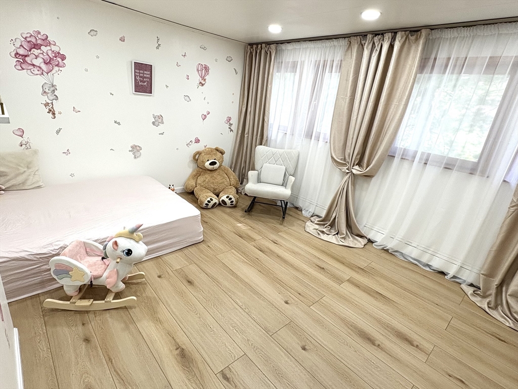 2 Pat Drive Danvers, MA 01923 - Photo 21 of 32 a spacious bedroom with a bed and a window