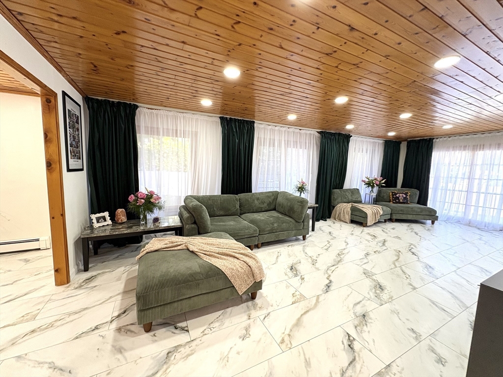 2 Pat Drive Danvers, MA 01923 - Photo 5 of 32 a bed room with a large bed and a large window