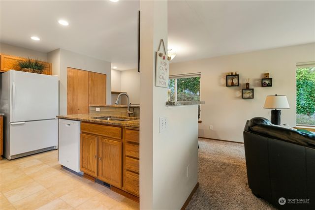 a kitchen with a refrigerator stove and sink