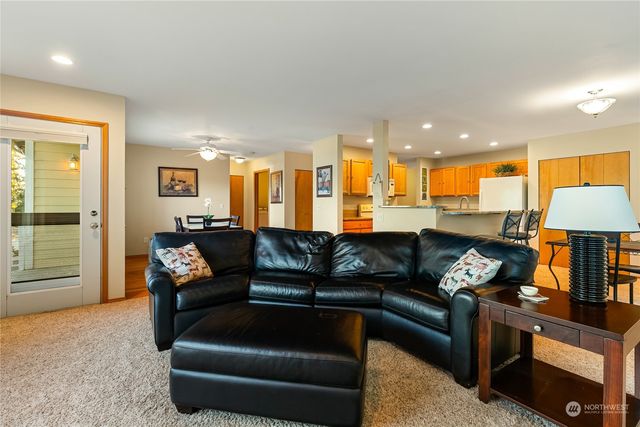 a living room with furniture and a lamp