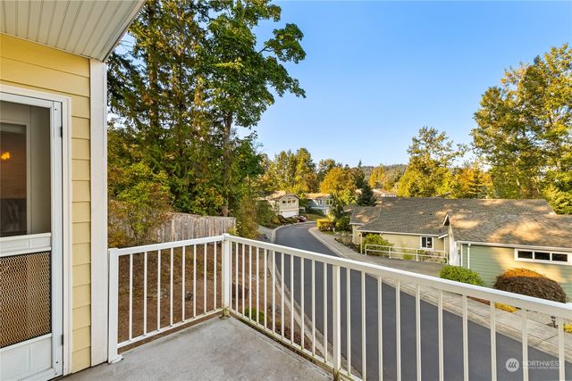 a view of a balcony with a tree