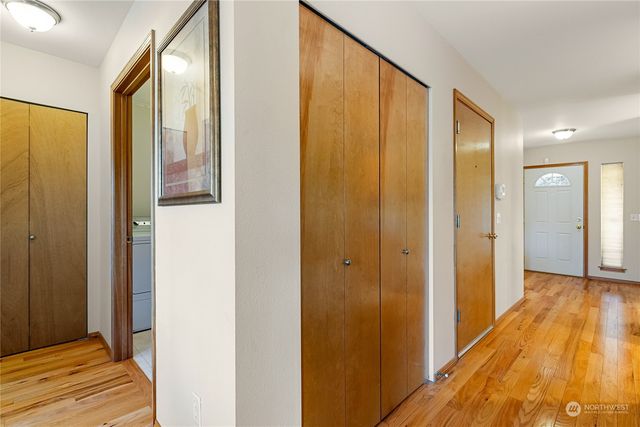 a view of a bathroom with shower and wooden floor