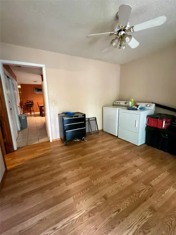 a bed room with a bed and a chandelier