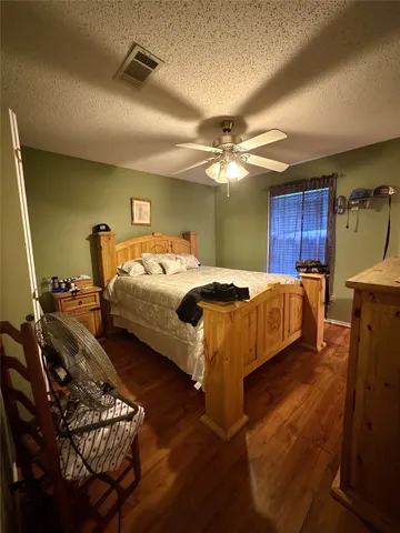 a bedroom with bed and window