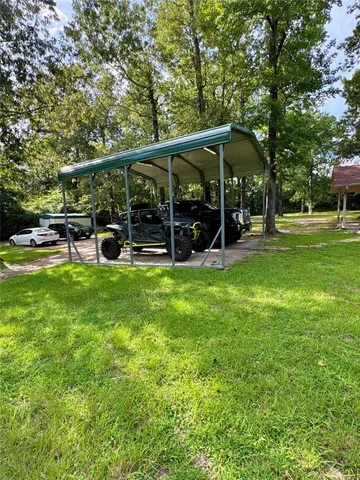 a view of a park with large trees