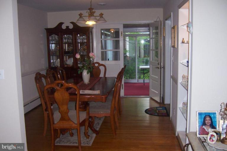 10212 Portland Road Silver Spring, MD 20901 - Photo 2 of 13 a view of a dining room with furniture and chandelier
