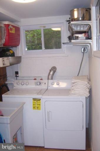 10212 Portland Road Silver Spring, MD 20901 - Photo 12 of 13 a utility room with stove and cabinets