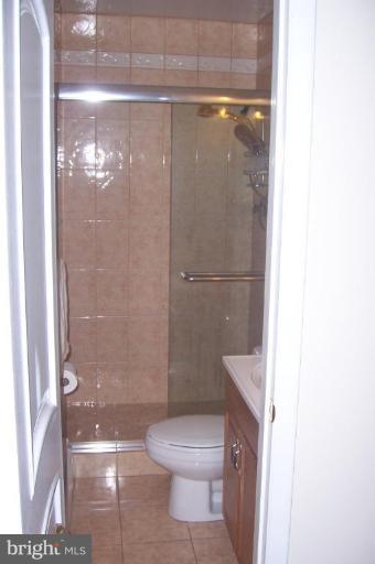 10212 Portland Road Silver Spring, MD 20901 - Photo 10 of 13 a bathroom with a toilet and a shower